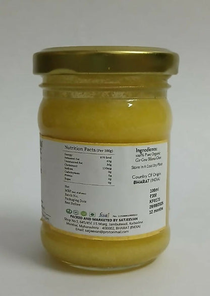 Organic Satjeevan Vedic Gir Cow Bilona Ghee jar with golden-yellow ghee inside, showcasing traditional cow ghee quality.