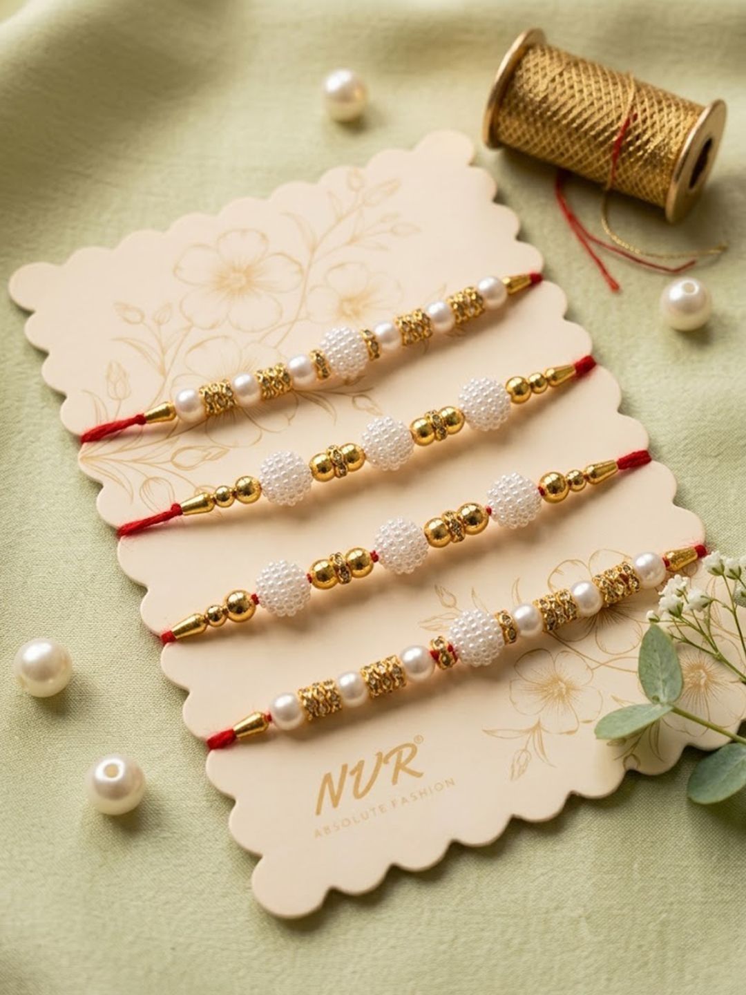 Anouk Set Of 4 White Pearls & Red Thread Rakhi With Roli Chawal Chandan Mishri