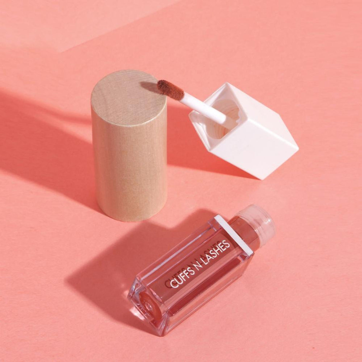 CUFFS N LASHES Matte Liquid Lipstick in Luxe shade, featuring the lipstick tube with a matte finish and the brand logo.