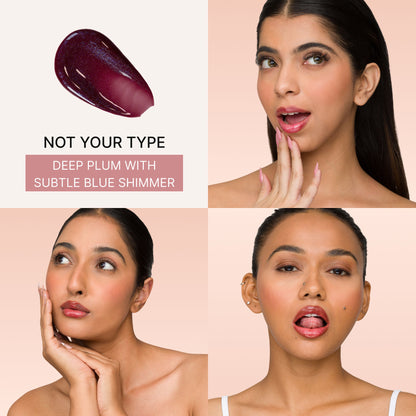 IRIS COSMETICS Talk Glossy To Me! Shimmer Lip Gloss in deep plum with subtle blue shimmer, showcasing its glossy finish and color.