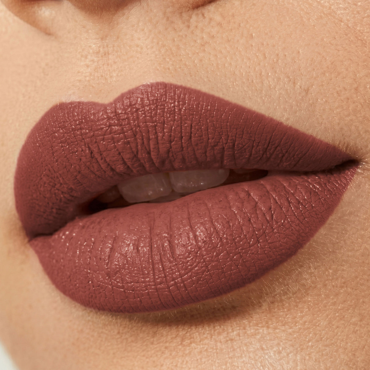 Flicka Bullet Lipstick in shade 10 with rich matte finish, showing the lightweight, intense pigment formula and sleek packaging.