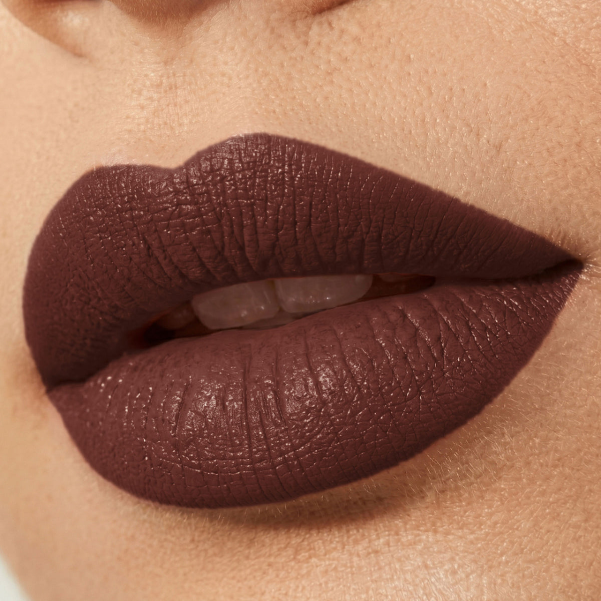 FLiCKA Flicka Tomato Bullet Lipstick Shade 12 showing a sleek tube with rich orange-red matte finish lipstick.