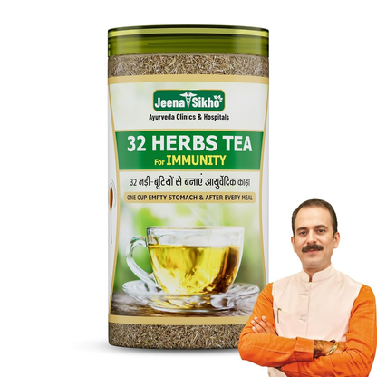 A cup of Jeena Sikho 32 Herbs Herbal Tea with dried herbs and flowers, highlighting natural ingredients for body detox.