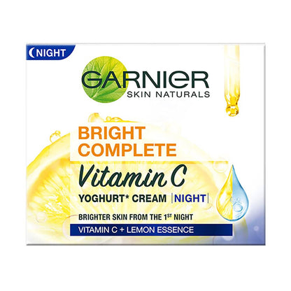 Garnier Bright Complete Vitamin C Yoghurt Night Cream jar with creamy texture and bright packaging, skincare product for glowing skin.