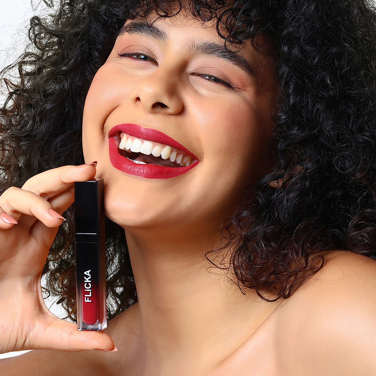 FLiCKA Flicka Attack Liquid Lipstick in Vintage Wine showing the dark red, smudge-proof, waterproof lipstick tube on a neutral background.