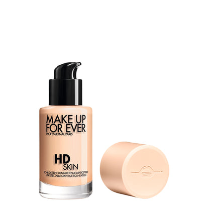 Make Up For Ever HD Skin Foundation in shade 1Y04 Warm Alabaster, close-up of the product bottle with pump dispenser.