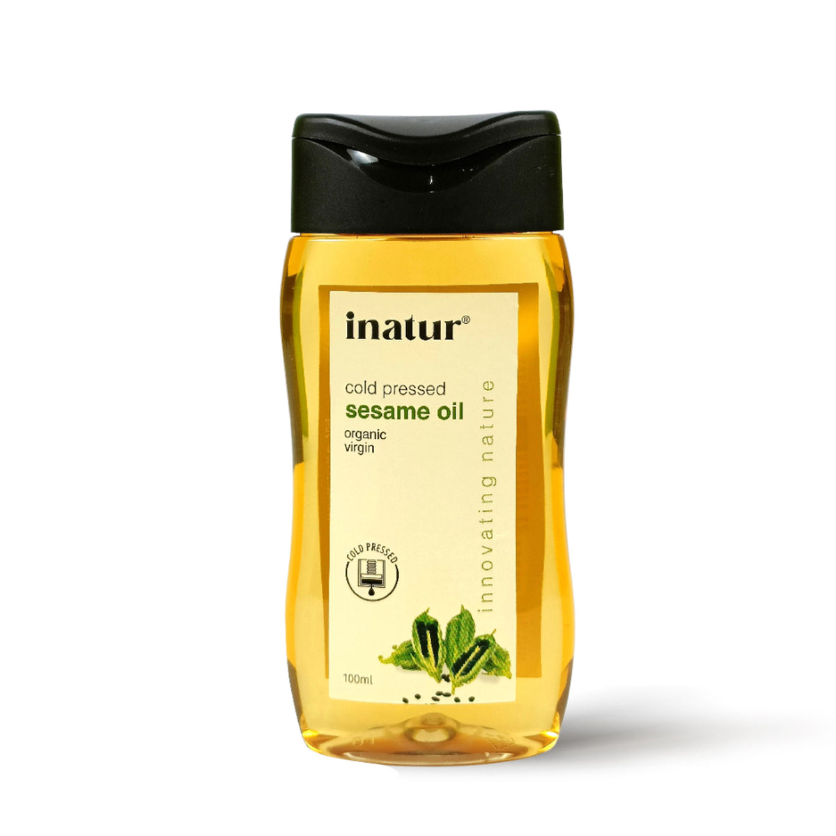 Inatur sesame oil bottle showing clear glass container with golden oil, labeled for skin and hair care, 100% pure and organic.