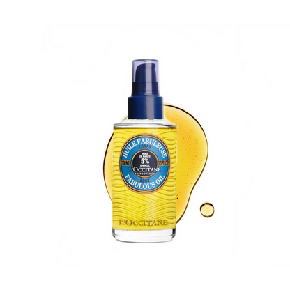 L'Occitane Shea Butter Fabulous Oil for face, featuring a clear glass bottle with a pump dispenser and golden oil inside.