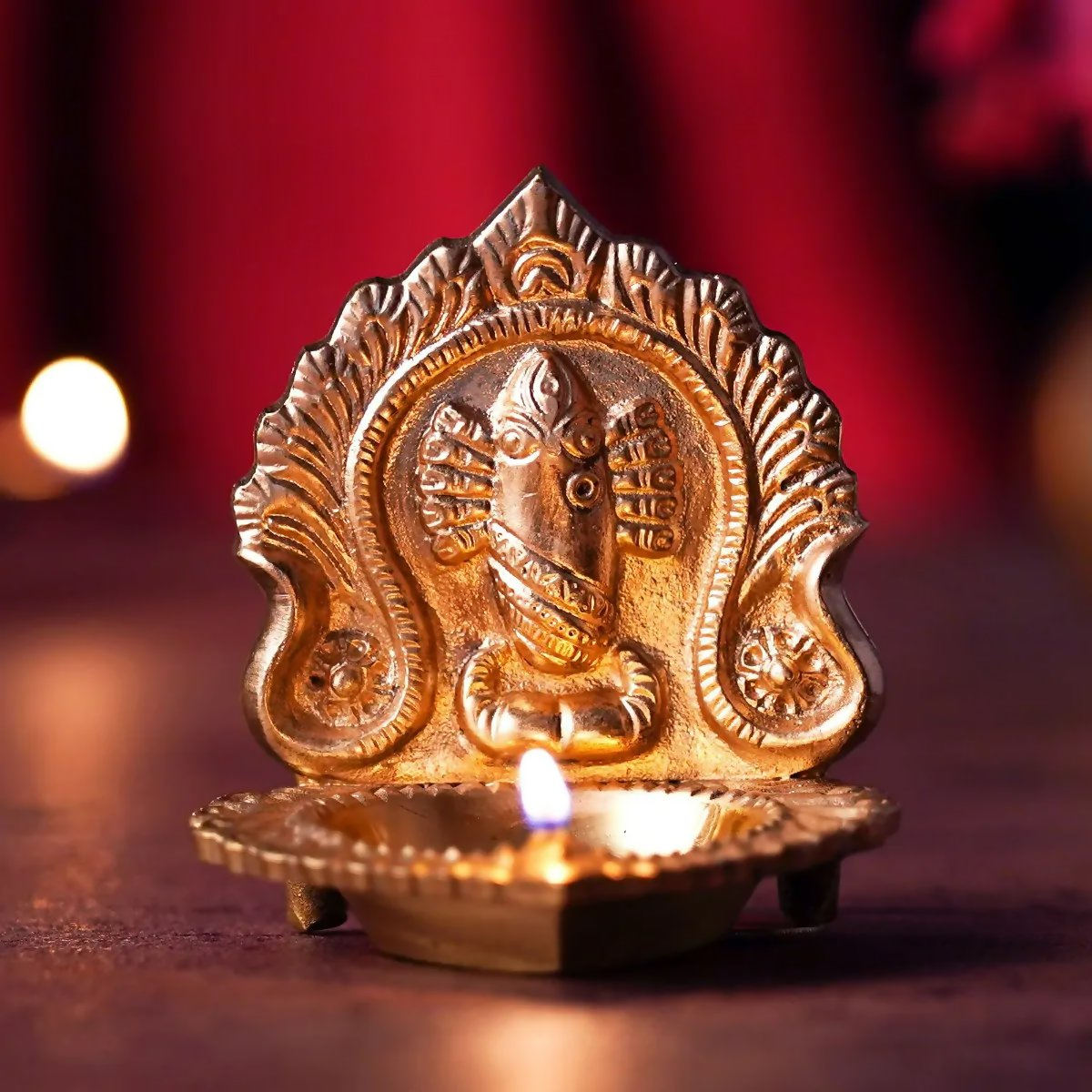 Brass Linga Bhairavi lamp idol from Isha Life featuring intricate carvings and traditional design for spiritual worship.