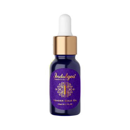 Indulgeo Essentials Wonder Gold Oil 24K gold-infused makeup face primer for dry, sensitive skin, with a sleek pump bottle and golden accents.