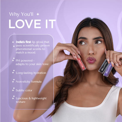 Bella Vita Organic pH Adapting Lip Gloss in Strip Tease shade, showing glossy finish on lips with natural light reflection.