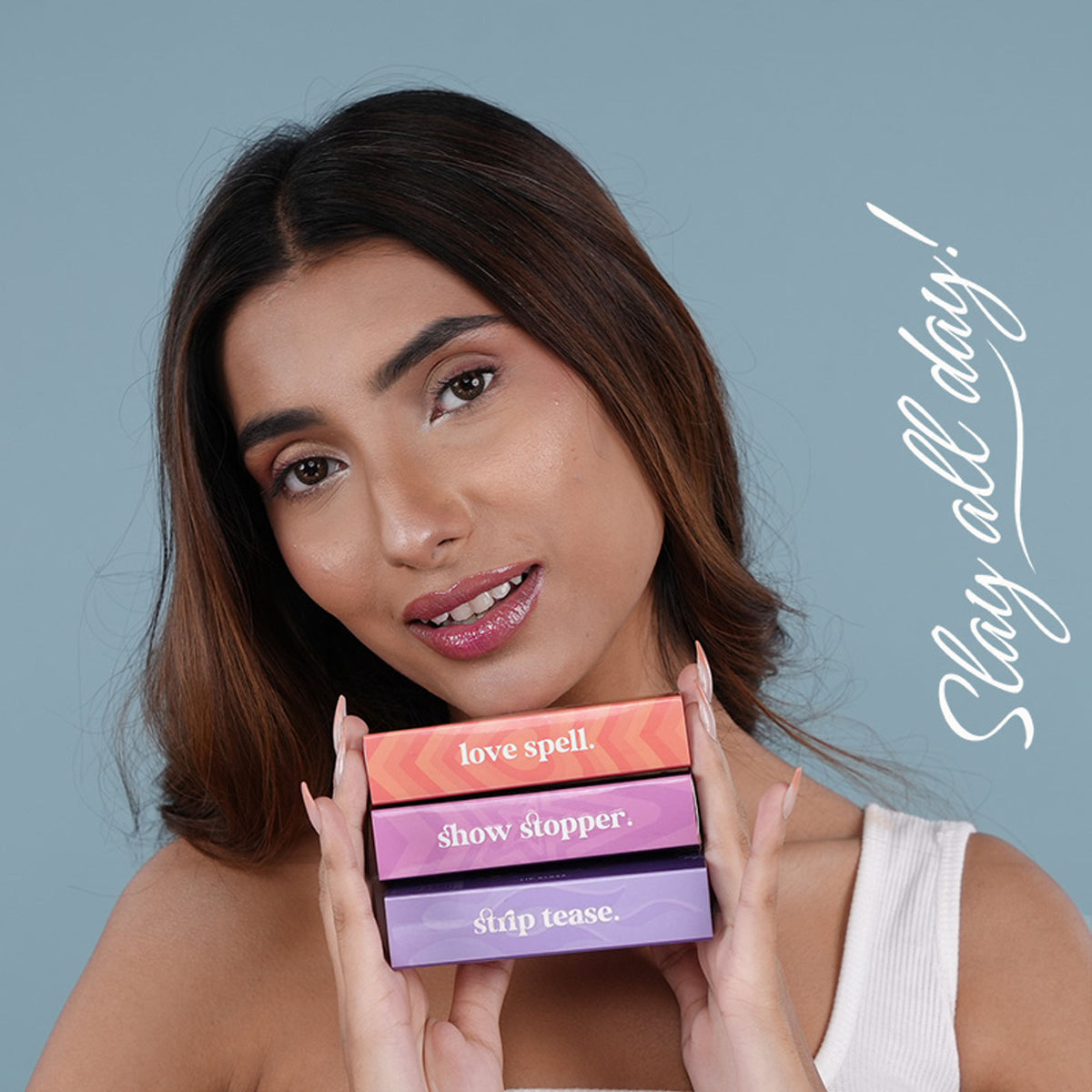 Bella Vita Organic pH Adapting Lip Gloss in Strip Tease, showing the glossy, color-changing lip gloss tube and applicator.