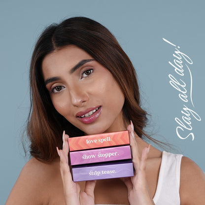 Bella Vita Organic pH Adapting Lip Gloss in Strip Tease, showing the glossy, color-changing lip gloss tube and applicator.