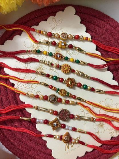 Anouk Set Of 10 Multicolor Designer Thread Rakhi With Roli Chawal Chandan Mishri