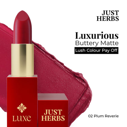 Just Herbs Luxe Satin Melt high-shine lipstick in shade 02 Plum Reverie, showing a smooth, rich plum-colored lipstick bullet.