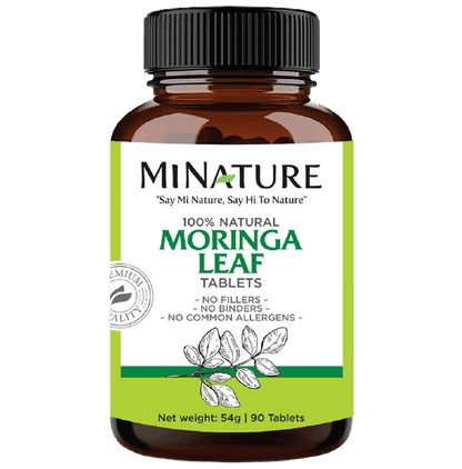 Minature Ayurvedic Moringa Leaf Tablets, 100% natural miniature supplement for health and wellness, shown in a clear blister pack.