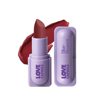 Blue Heaven Love Capsule Matte Lipstick in Midnight Berry, showcasing deep blue and purple tones in a sleek bullet.