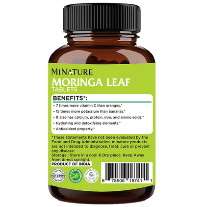 Miniature 100% natural Moringa leaf Ayurvedic tablets in a blister pack, showcasing the herbal supplement's packaging.