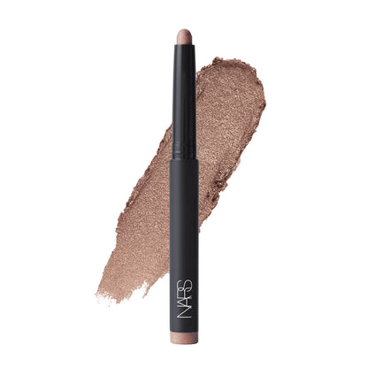 NARS Total Seduction Eyeshadow Stick in Living Sin, creamy eyeshadow swatched on hand showcasing its rich, shimmery brown color.