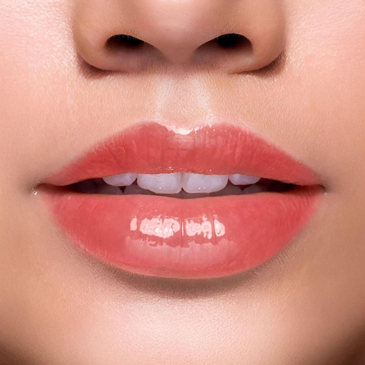 BLUR It's Giving Honey Lip Oil in strawberry flavor, featuring a sleek tube with a glossy finish and a strawberry illustration.