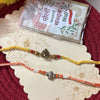 Dhiyona Set Of 2 Multicolor Religious Thread Rakhi With Roli Chawal Chandan Mishri