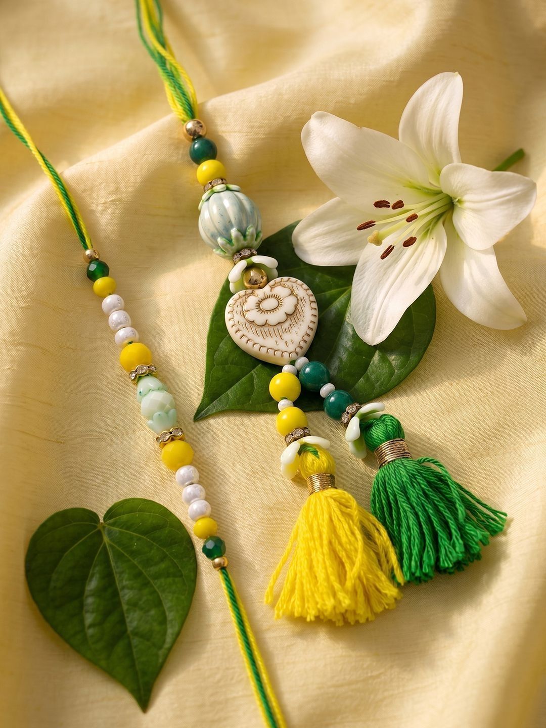 Anouk Set Of 2 Green & Yellow Beaded Heart Shape Bhaiya Bhabhi Rakhi With Roli Chawal