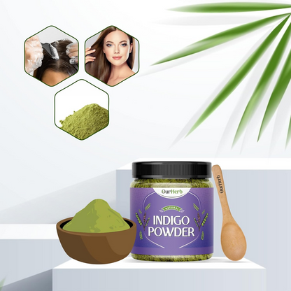 OurHerb organic indigo leaves powder for black hair color, displayed in a bowl with fresh indigo leaves on a wooden surface.