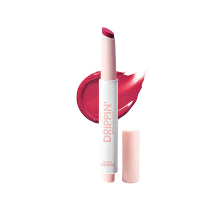 Flossy Cosmetics tinted lip balm with Shea Butter and Jojoba Oil on dry lips, featuring a natural Jamun shade for brightening and moisturizing.
