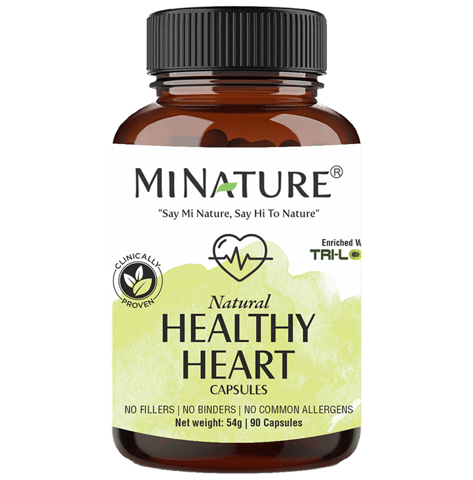 Minature Natural Healthy Heart Ayurvedic Capsules in a clear bottle with colorful label and capsules visible inside.
