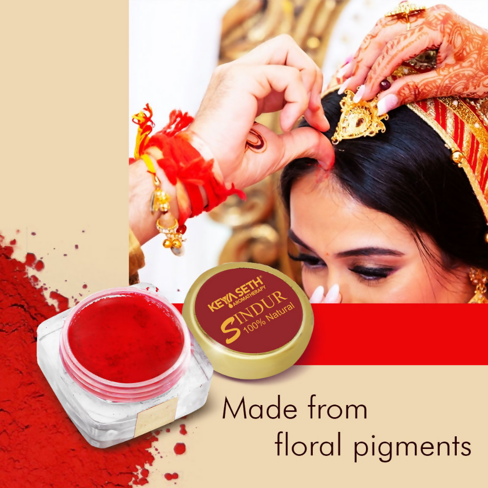 Keya Seth Aromatherapy Red Sindoor powder in a small container, natural makeup product used for traditional Indian adornment.