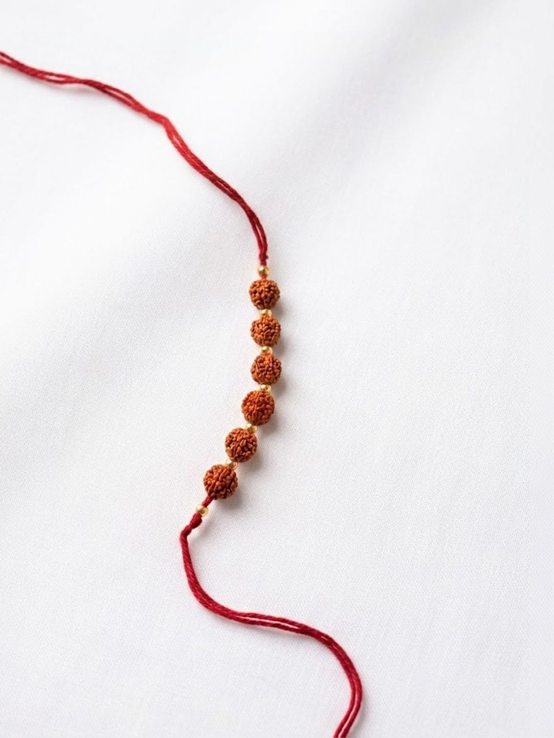 Anouk Religious Rudraksh Thread Rakhi With Roli Chawal Chandan Mishri