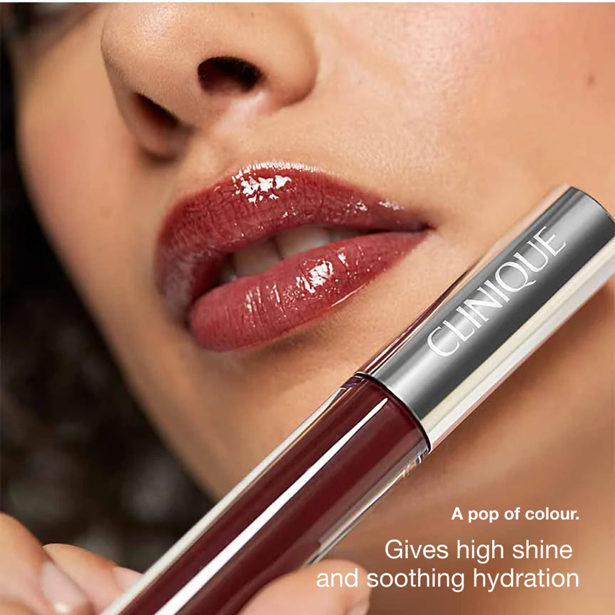 Clinique Pop Plush Creamy Lip Gloss in Black Honey, showcasing the smooth, glossy texture and rich color of the lip gloss.