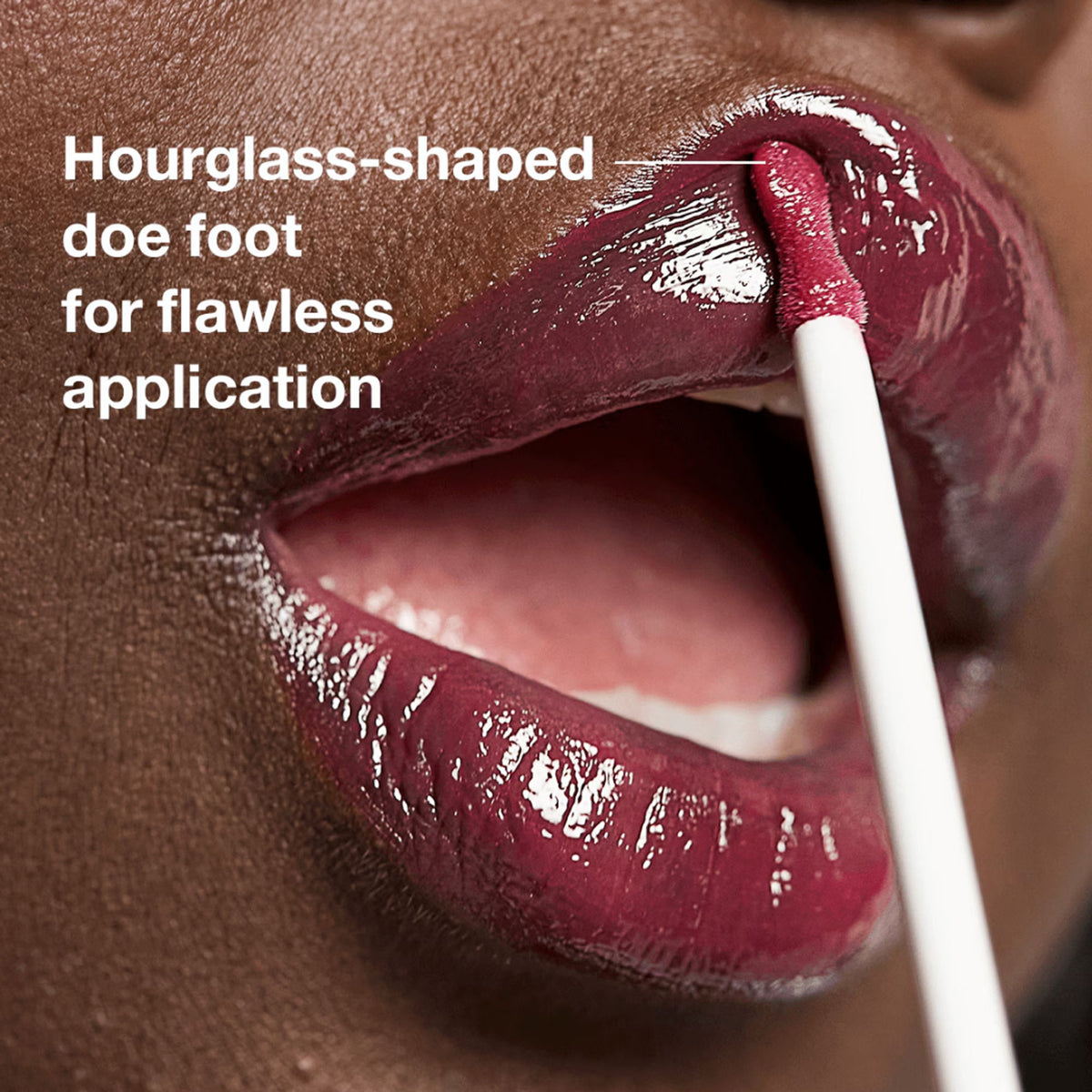 Clinique Pop Plush Creamy Lip Gloss in Black Honey, showing a smooth, glossy lip gloss applied to lips with a subtle tint.