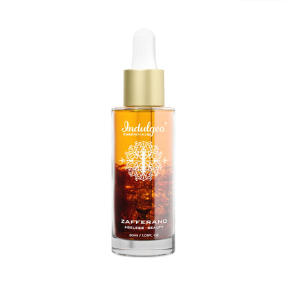 Indulgeo Essentials Ageless Beauty Zafferano Oil with saffron, lupin seed extract, and coenzyme Q10 in a glass bottle.