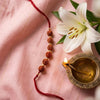 Dhiyona Religious Rudraksh Thread Rakhi With Roli Chawal Chandan Mishri