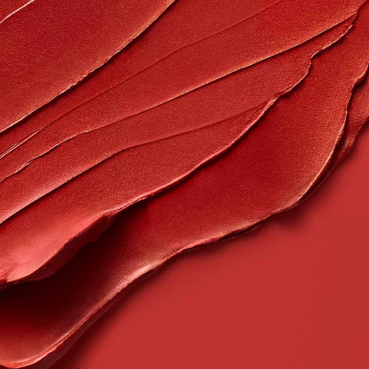 Estee Lauder Pure Color Whipped Matte Lip Color in Shock Me, vibrant coral lipstick in a sleek tube.
