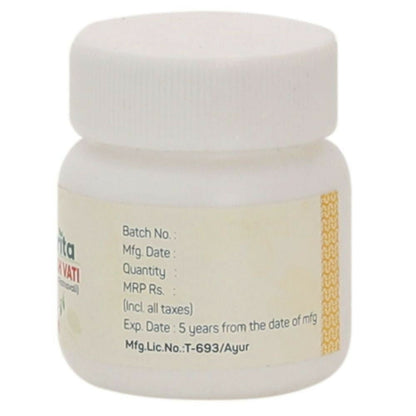 Amrita Amavatari Ras Ayurvedic tablets in a glass jar with tablets visible inside, showcasing traditional herbal medicine.
