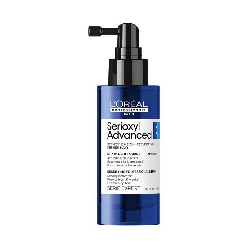 L’Oreal Professionnel Serioxyl Advanced Density Activator hair serum in a clear bottle with a pump dispenser, designed to boost hair density.