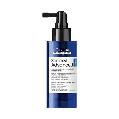 L’Oreal Professionnel Serioxyl Advanced Density Activator hair serum in a clear bottle with a pump dispenser, designed to boost hair density.
