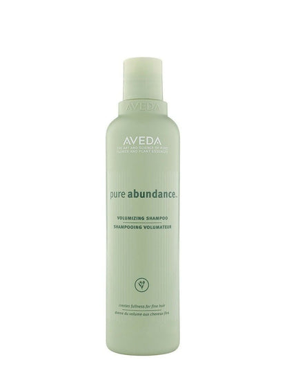 Aveda Pure Abundance Volumizing Shampoo bottle with white label and clear cap, designed for adding volume to hair.