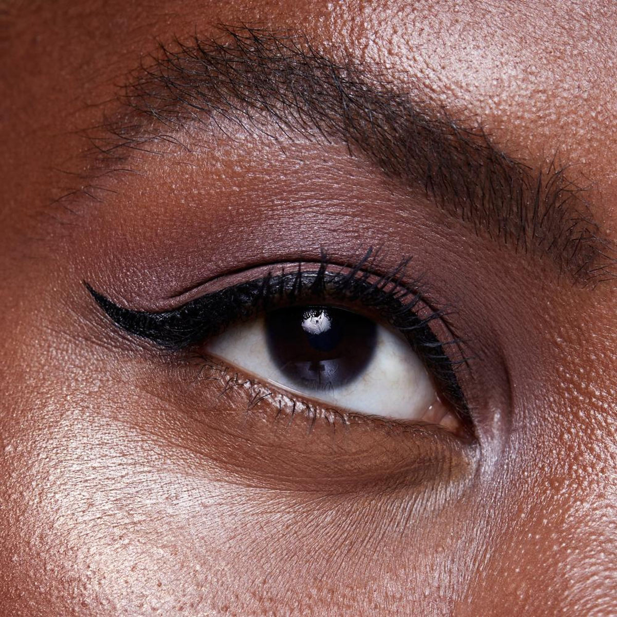Huda Beauty Life Liner Quick'n Easy Precision Liquid Liner in Vanta with a sleek black applicator brush on a white background.
