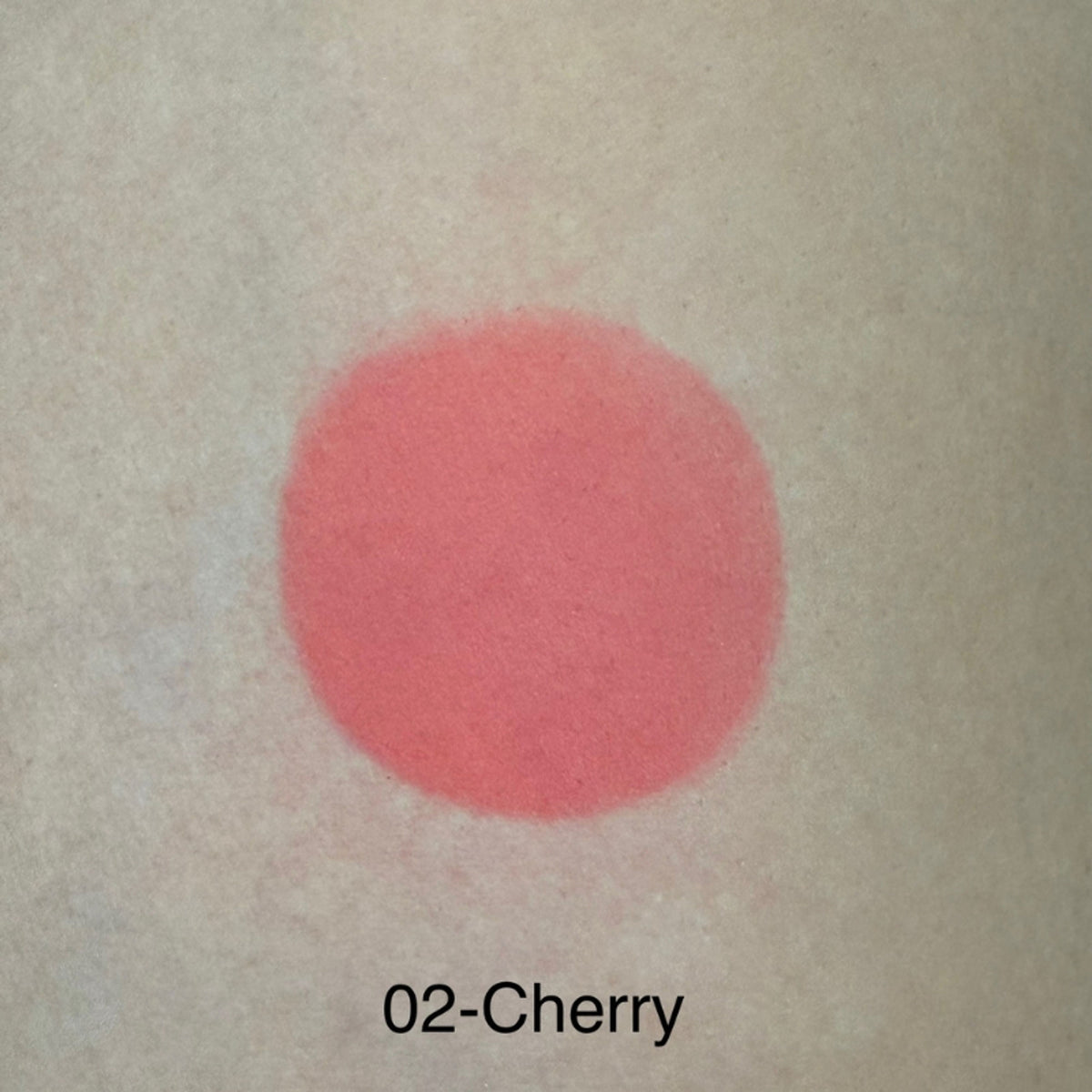 Europe Girl Cheek Dew Liquid Blush EG-02 Cherry, close-up of vibrant red liquid blush in sleek packaging with applicator brush.