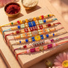 Dhiyona Set Of 7 Multicolor Designer Thread Rakhi With Roli Chawal Chandan Mishri
