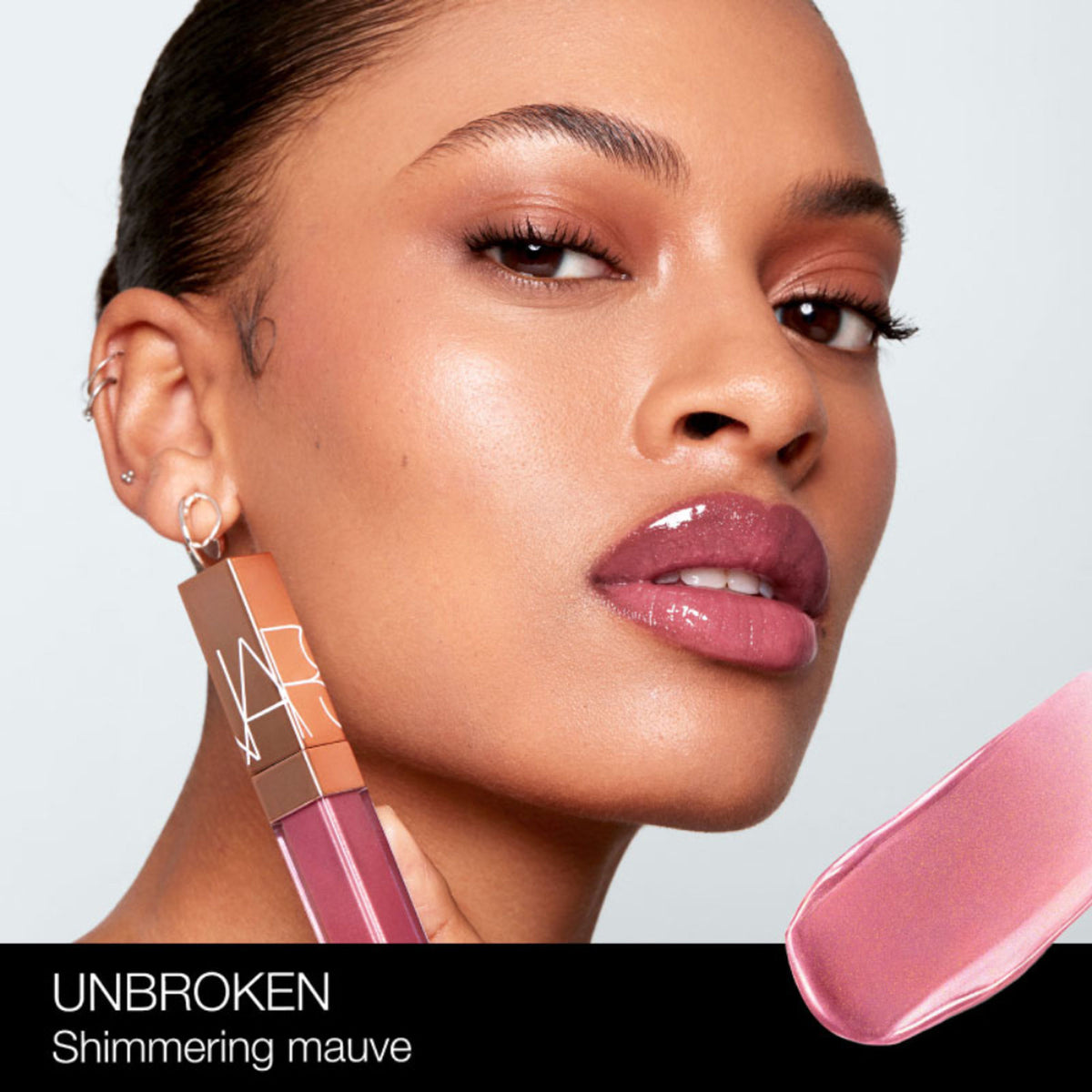 NARS Afterglow Lip Shine in Unbroken, close-up of the glossy lip product with a smooth, shiny finish.