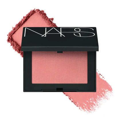 NARS Deep Throat blush in a warm peachy pink shade, displayed in sleek compact with the blush visible.