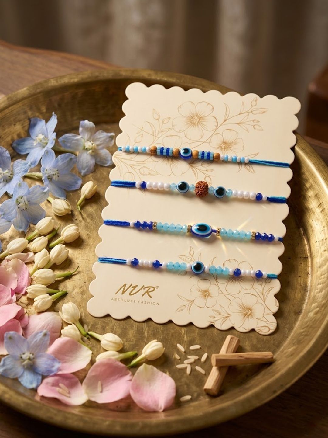 Anouk Set Of 4 Blue Evil Eye Thread Rakhi With Roli Chawal Chandan Mishri