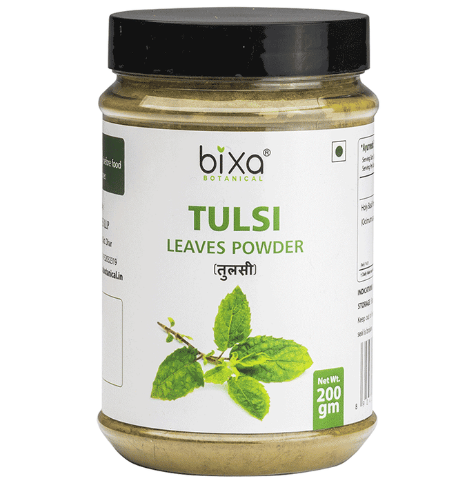 Bixa Botanical Tulsi powder in a jar, showing vibrant green herbal powder, used in Ayurvedic practices for wellness and health.