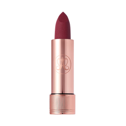 Anastasia Beverly Hills Matte Lipstick in Blackberry shade, showing the lipstick tube and swatched on a model's lips.