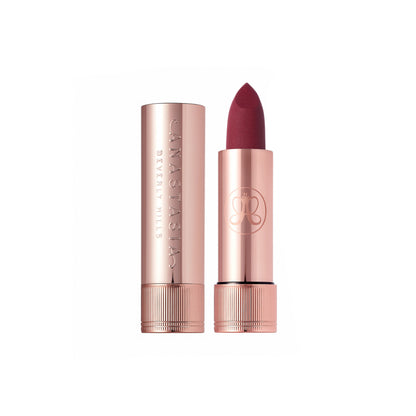 Anastasia Beverly Hills Matte Lipstick in Blackberry shade, showing the sleek black tube and rich, deep purple lipstick inside.
