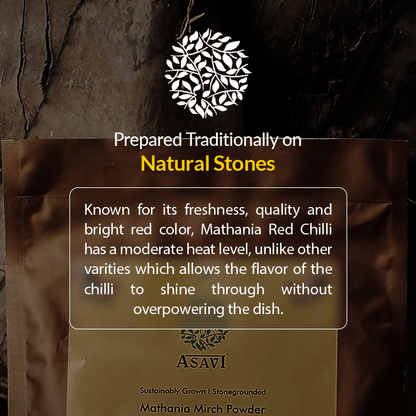 Asavi Stone Grounded Mathania Chilli Powder in a jar showing vibrant red chili flakes and powder inside.